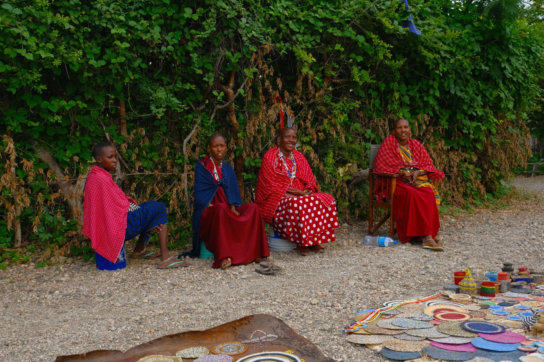 Maasai women seated behind the beadwork they make and sell.